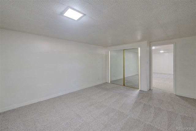 6054 Iris Way, Arvada, CO 80004 - basement featuring carpet and baseboards