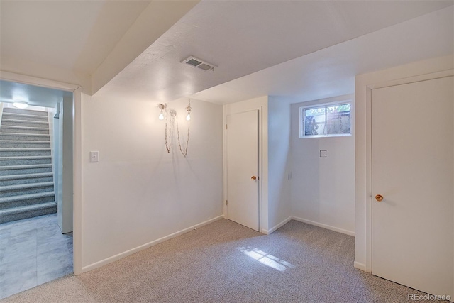 6054 Iris Way, Arvada, CO 80004 - basement featuring light carpet and stairway