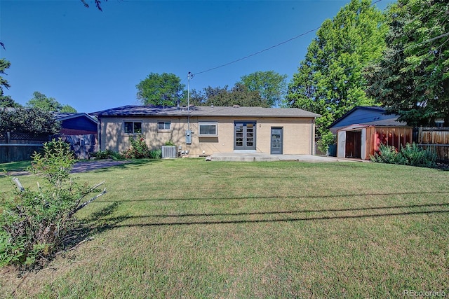 6054 Iris Way, Arvada, CO 80004 - back of property with a storage unit and a patio area