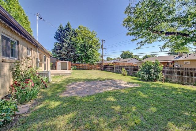 6054 Iris Way, Arvada, CO 80004 - fenced backyard with a shed and a patio area