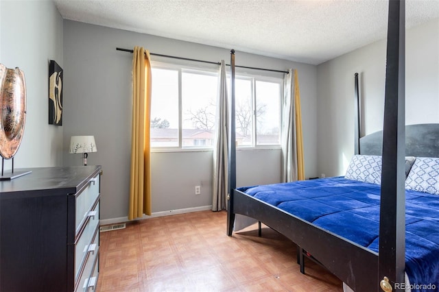 bedroom with a textured ceiling