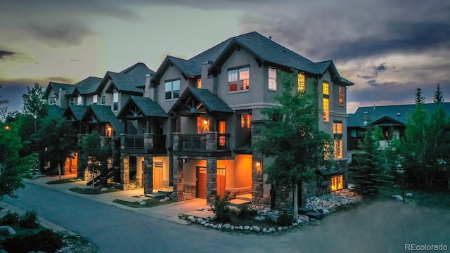 701 Red Quill Way, Winter Park, CO 80482 - view of front of home with stucco siding, stone siding, and a balcony