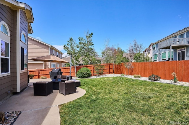 view of yard featuring a fenced backyard, an outdoor living space, and a patio area