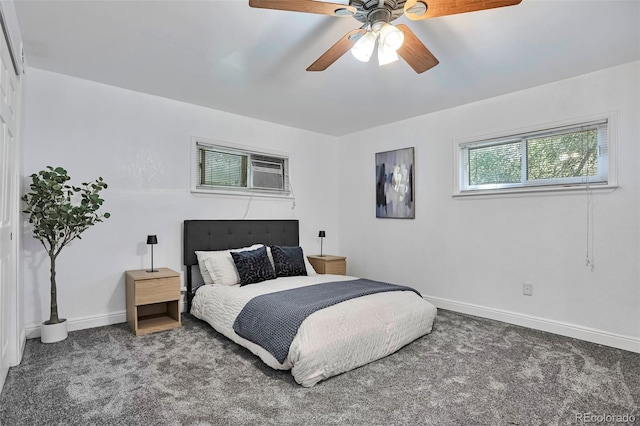 3052 S Grape Way, Denver, CO 80222 - carpeted bedroom featuring a wall mounted air conditioner and ceiling fan