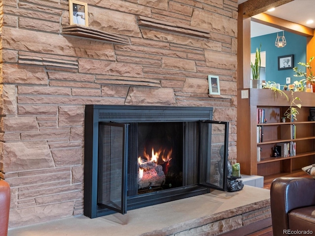 interior details featuring a stone fireplace