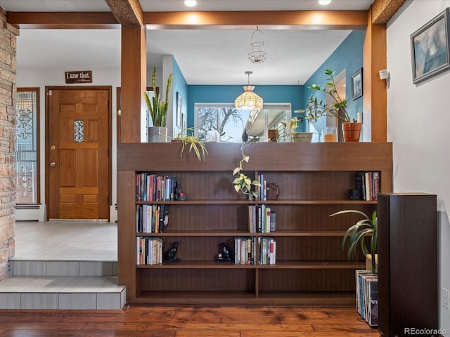 entrance foyer featuring dark hardwood / wood-style floors and a baseboard heating unit