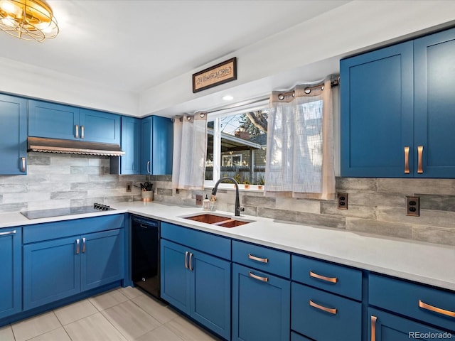 kitchen with black appliances, blue cabinets, extractor fan, and sink