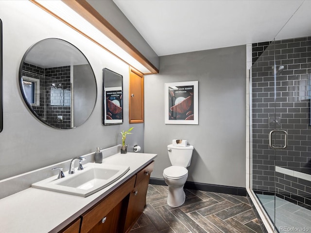 bathroom featuring toilet, walk in shower, and vanity