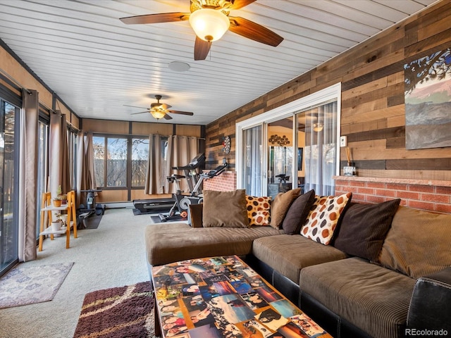 living room featuring carpet floors and wooden walls