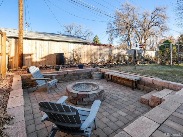 view of patio / terrace with an outdoor fire pit