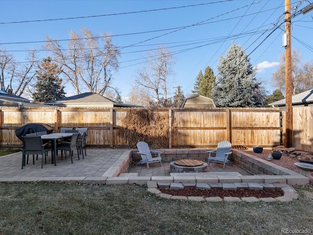 view of patio / terrace with a fire pit