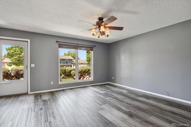 2554 S Laredo Ct, Aurora, CO 80013 - unfurnished room with a textured ceiling, a ceiling fan, wood finished floors, and baseboards
