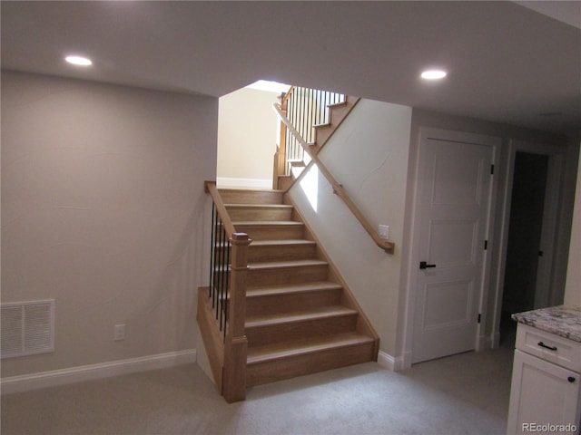 stairs with baseboards, carpet floors, visible vents, and recessed lighting