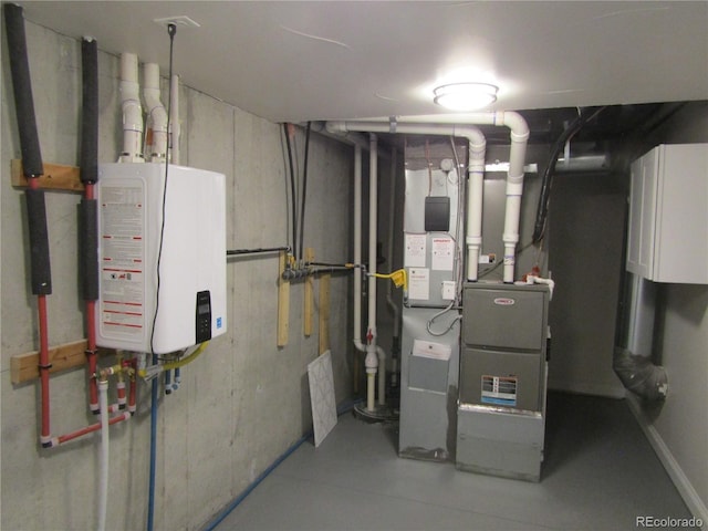 utility room with water heater and heating unit