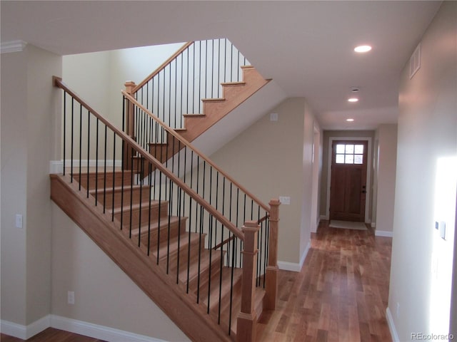 1970 S Logan St, Denver, CO 80210 - stairs with wood finished floors, recessed lighting, and baseboards