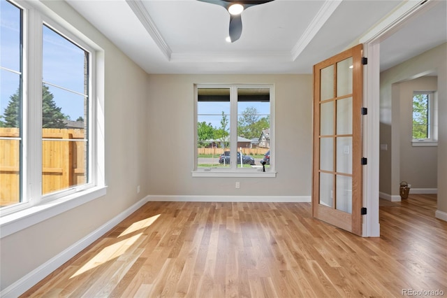 1970 S Logan St, Denver, CO 80210 - unfurnished room featuring a tray ceiling, light wood-type flooring, baseboards, crown molding, and a ceiling fan