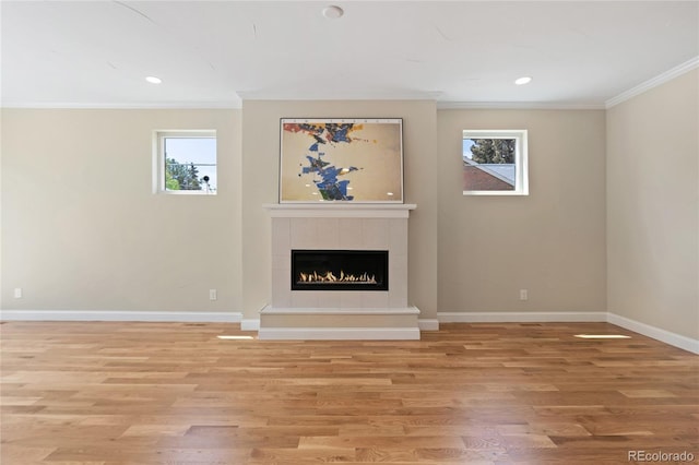 1970 S Logan St, Denver, CO 80210 - unfurnished living room featuring crown molding, light wood-type flooring, baseboards, a fireplace, and recessed lighting