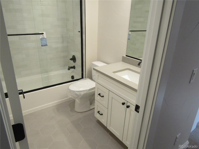 1970 S Logan St, Denver, CO 80210 - full bathroom featuring tile patterned flooring, toilet, vanity, and bath / shower combo with glass door