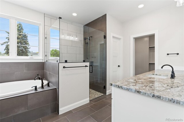 1970 S Logan St, Denver, CO 80210 - bathroom featuring a stall shower, a bath, tile patterned floors, recessed lighting, and vanity