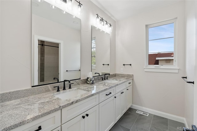 1970 S Logan St, Denver, CO 80210 - full bathroom featuring baseboards, marble look tiles, and double vanity