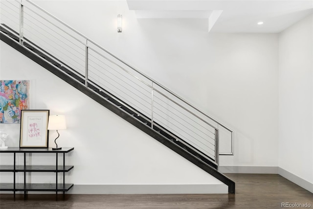 staircase featuring hardwood / wood-style flooring