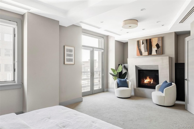 carpeted bedroom with access to outside and french doors