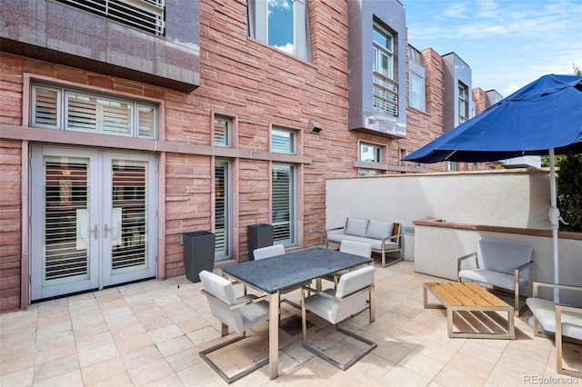 view of patio featuring outdoor lounge area and french doors