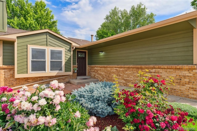 13849 W 66th Dr, Arvada, CO 80004 - entrance to property featuring brick siding