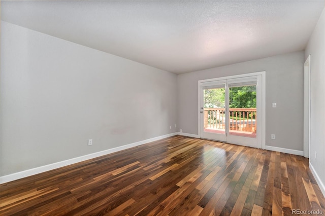 13849 W 66th Dr, Arvada, CO 80004 - unfurnished room with dark wood-type flooring and baseboards
