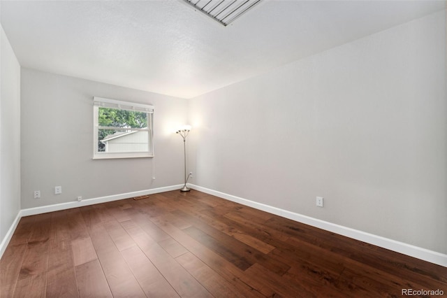 13849 W 66th Dr, Arvada, CO 80004 - spare room with dark wood finished floors and baseboards