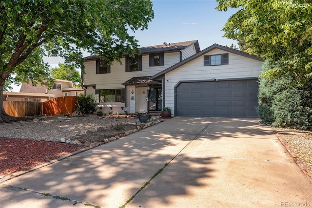 10851 E Iliff Pl, Aurora, CO 80014 - traditional-style house featuring an attached garage and concrete driveway