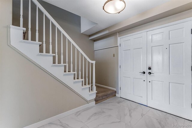 10851 E Iliff Pl, Aurora, CO 80014 - foyer entrance with marble finish flooring and stairway