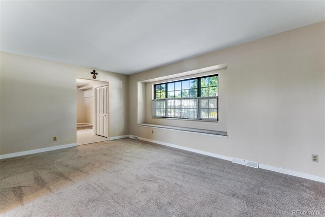 10851 E Iliff Pl, Aurora, CO 80014 - spare room with carpet flooring and baseboards
