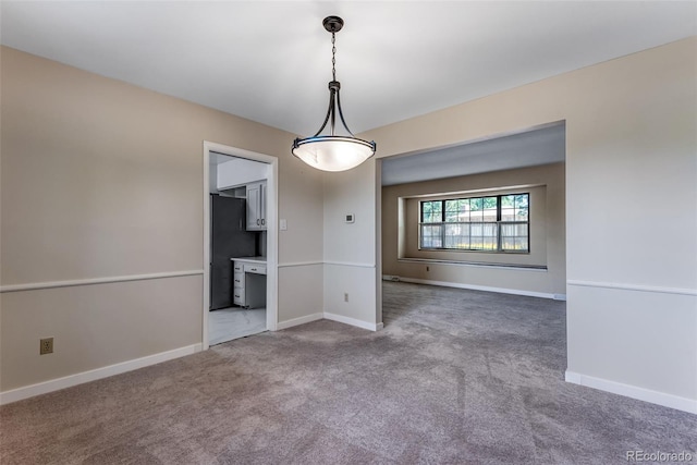 10851 E Iliff Pl, Aurora, CO 80014 - spare room featuring carpet floors and baseboards