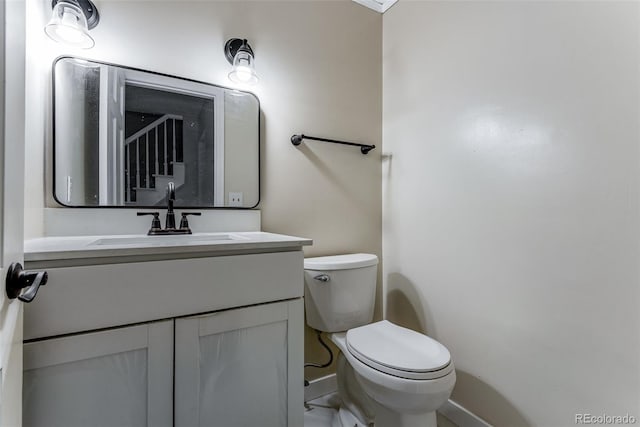 10851 E Iliff Pl, Aurora, CO 80014 - half bathroom featuring baseboards and vanity