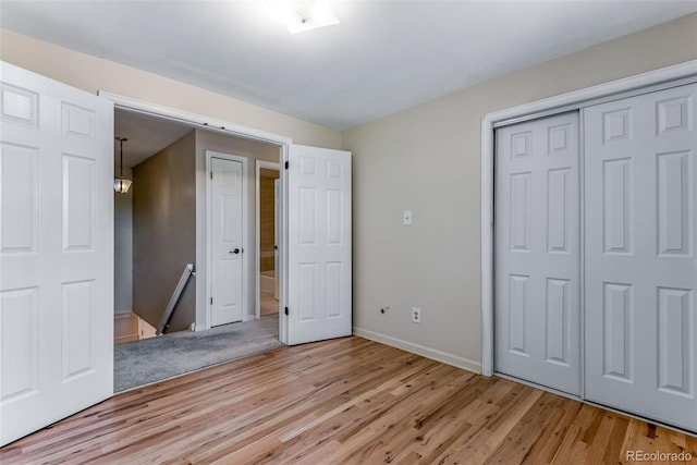 10851 E Iliff Pl, Aurora, CO 80014 - unfurnished bedroom with wood finished floors and a closet