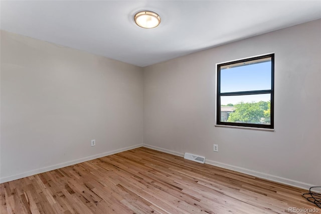 10851 E Iliff Pl, Aurora, CO 80014 - unfurnished room featuring light wood-type flooring and baseboards