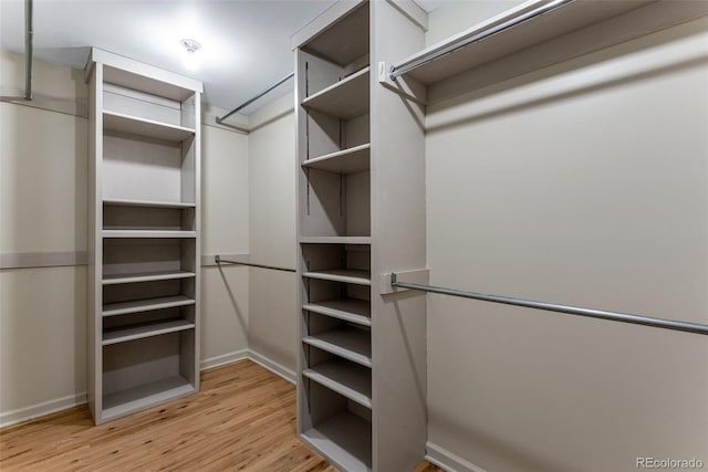 10851 E Iliff Pl, Aurora, CO 80014 - spacious closet featuring wood finished floors