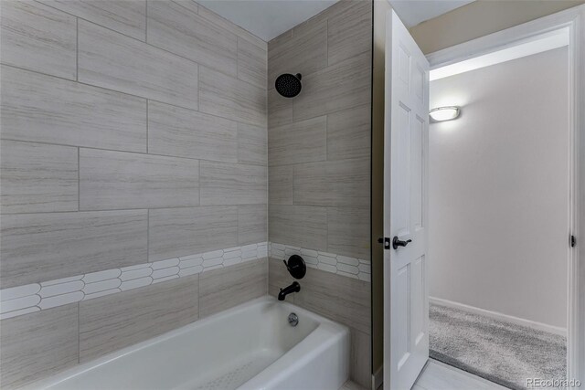 10851 E Iliff Pl, Aurora, CO 80014 - bathroom with shower / bath combination and baseboards