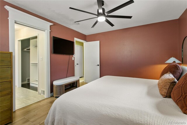 5280 S Logan St, Littleton, CO 80121 - bedroom with wood finished floors, ceiling fan, and a spacious closet
