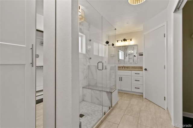 5280 S Logan St, Littleton, CO 80121 - full bath with a stall shower, vanity, a walk in closet, and tile patterned flooring