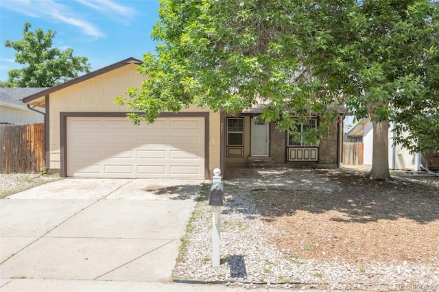 3577 S Ouray Cir, Aurora, CO 80013 - view of front facade with a garage and driveway