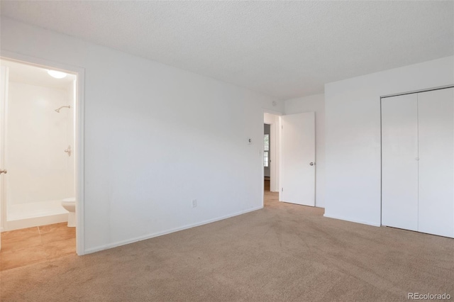 3577 S Ouray Cir, Aurora, CO 80013 - unfurnished bedroom with carpet, ensuite bathroom, and a closet