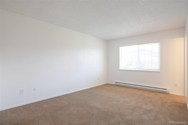 3577 S Ouray Cir, Aurora, CO 80013 - spare room with a baseboard radiator, carpet floors, and a textured ceiling