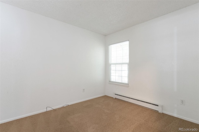 3577 S Ouray Cir, Aurora, CO 80013 - empty room with a baseboard heating unit, light carpet, and a textured ceiling