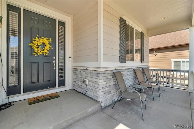23913 E Swallow Cir, Aurora, CO 80016 - property entrance featuring covered porch