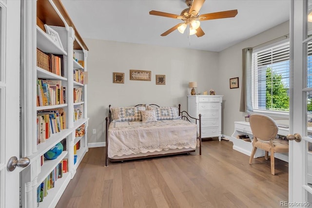 23913 E Swallow Cir, Aurora, CO 80016 - bedroom featuring wood finished floors and a ceiling fan