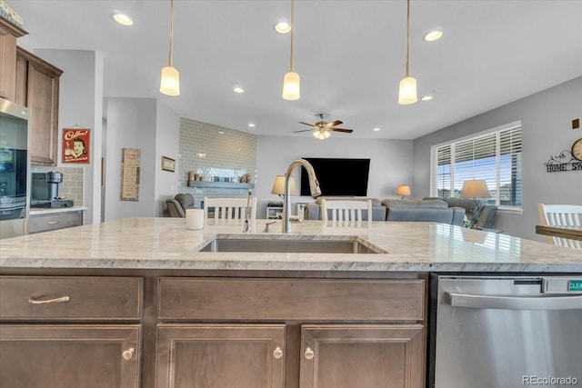 23913 E Swallow Cir, Aurora, CO 80016 - kitchen featuring stainless steel dishwasher, open floor plan, a ceiling fan, recessed lighting, and decorative light fixtures
