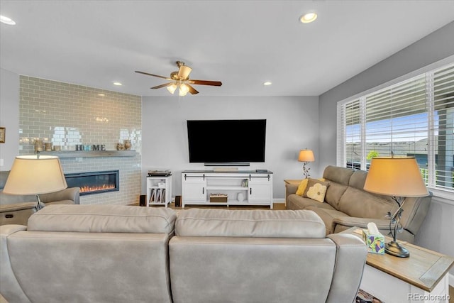 23913 E Swallow Cir, Aurora, CO 80016 - living area featuring a ceiling fan, recessed lighting, and a glass covered fireplace