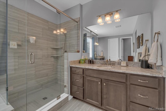 23913 E Swallow Cir, Aurora, CO 80016 - full bathroom featuring vanity and a shower stall